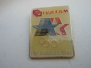 Olympic PIN Fuji Film Sponsor Vtg. LA '84 Has Stars in Motion & Rings & L. A. - Picture 1 of 2