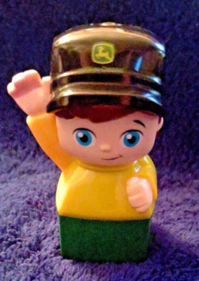 Mega block John Deere brown hair, blue-eyed, green and yellow body  - Image 1 of 4