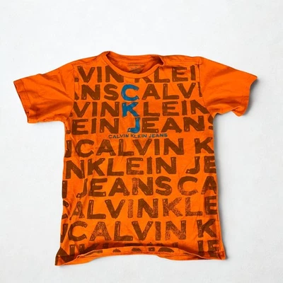 Camisa Jeans Calvin Klein Niños M Naranja Logo CKJ Gráfico Manga Corta Algodón Camiseta Foto 1 de 4