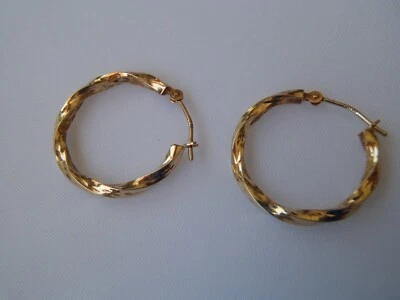 10k yellow gold Twisted Hoop Earrings .8g - Image 1 of 4