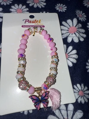 Pulsera expandible de cristal rosa, blanco y dorado Foto 1 de 4