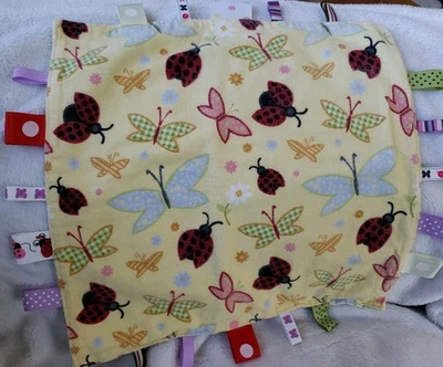 Taggies Baby Lovey & Manta de Seguridad Mariposa Amarilla Ladybug 11 5/8" x 11 5/8" Foto 1 de 4