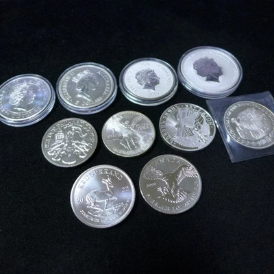 Lot of (10) different - 1 oz Silver Coins .999 Silver From Around The World BU - Image 1 of 4