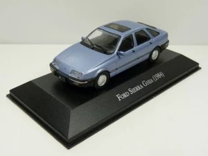 EX RIVISTA MODELLINI FORD SIERRA GHIA AZZURRO 1984 SCALA 1-43 LX99 - Foto 1 di 3