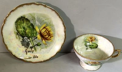 Taza y platillo Norcrest Fine China julio lirio de agua cumpleaños Demitasse iridiscente Foto 1 de 2