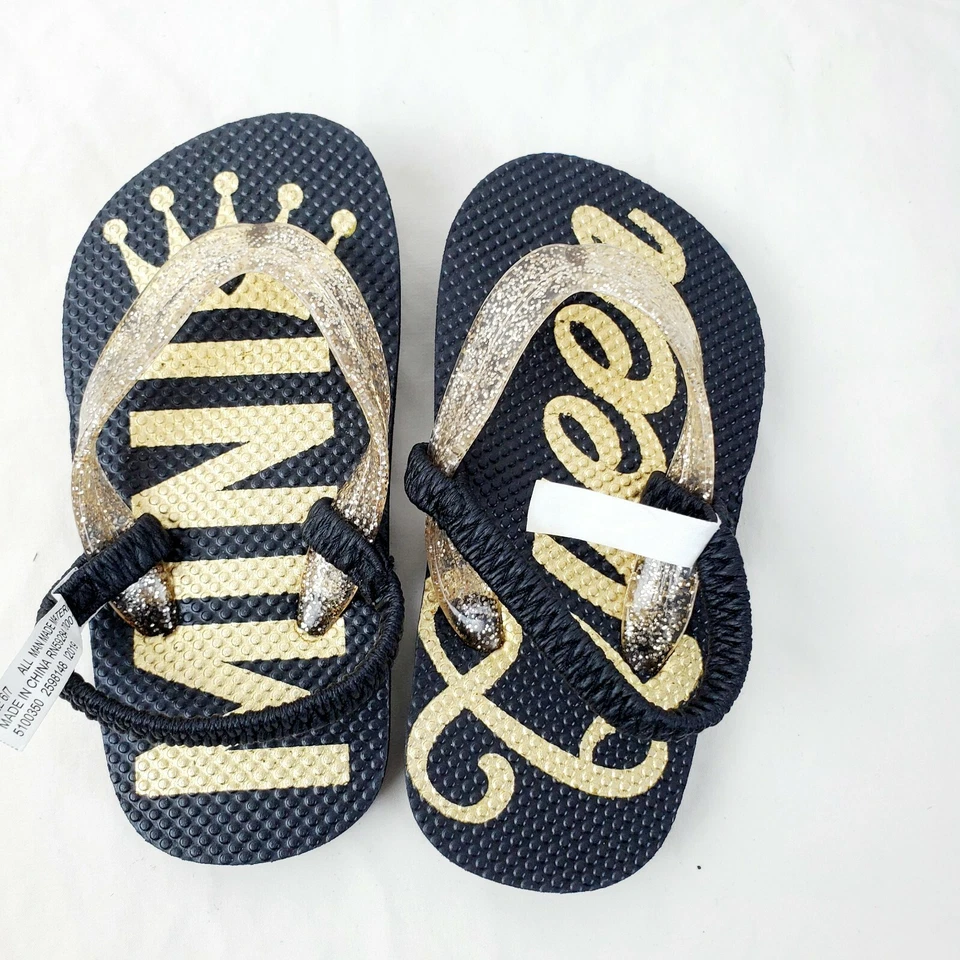 Sandalias Chanclas The Children’s Place Bebé Niña Negro Dorado Brillo Mini Reina Foto 1 de 4