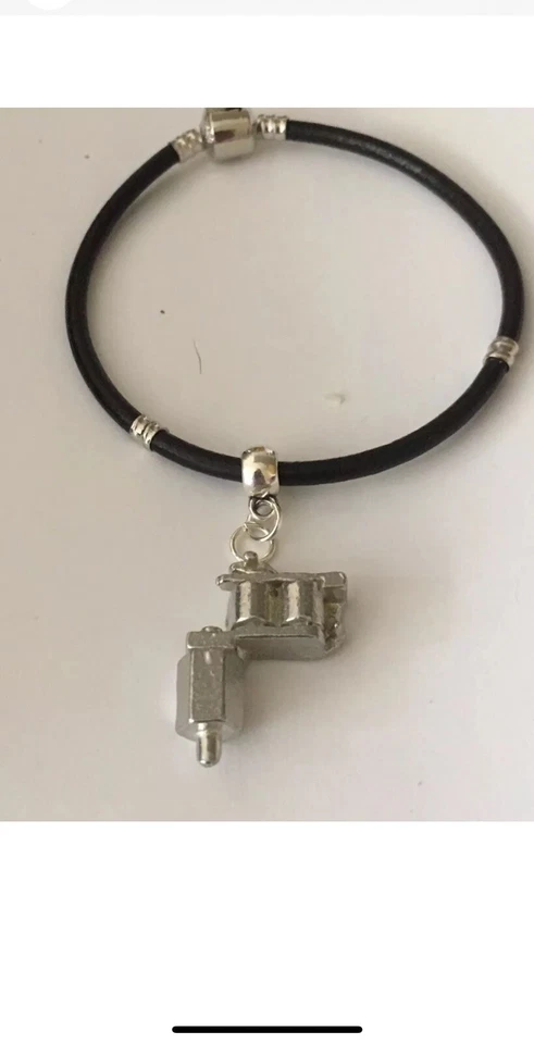 Tattoo Gun TG55 on a silver Faux Leather Snake Bracelet  - Bild 1 von 1