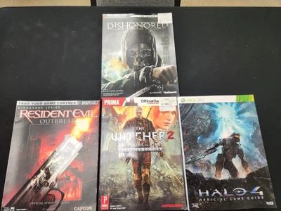 Lot strategy guides- Residnet Evil outbreak, Witcher 2, Halo 4, Dishonored - Image 1 of 2