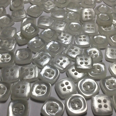 Camisa de polietileno cuadrada de imitación de tono blanco perla tamaño botón 11 mm 3/8" 4 orificios Foto 1 de 3