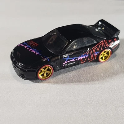 HKS Nissan Skyline R33 - Hot Wheels - Gold Custom Wheels - Red Wall Real Riders - Image 1 of 4
