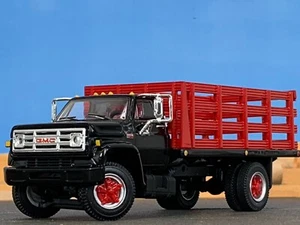 1/64 DCP BLACK/RED GMC 6500 SINGLE AXLE STAKE BED - Picture 1 of 5
