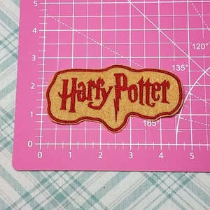 Harry Potter Buchstabe Logo Patch Bügelbild Logo Applikation bestickt Patch - Bild 1 von 2