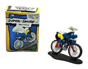 Figura de ciclista vintage Schleich Super Pitufo n.º 6707 con caja original - Imagen 1 de 8