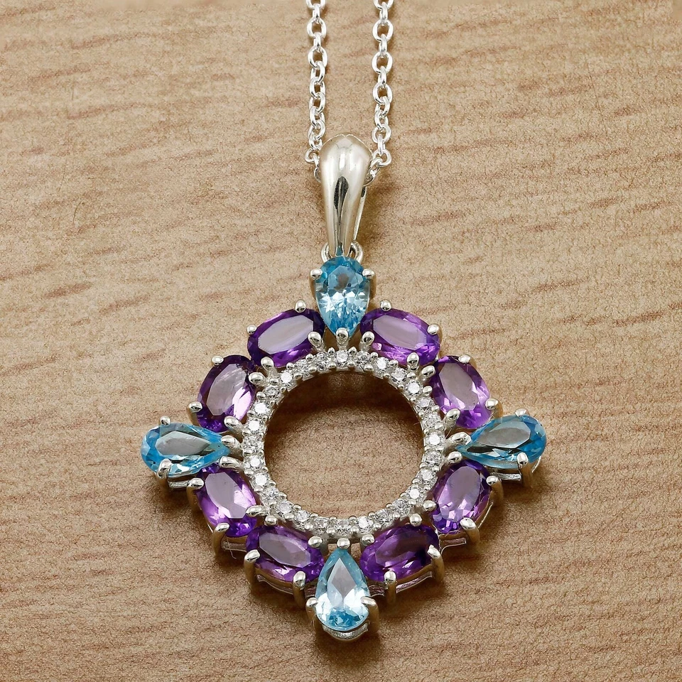 Colgante circular de topacio azul simulado corte pera de 3,50 quilates enchapado en oro blanco de 14 k Foto 1 de 4