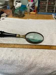 VINTAGE MAGNIFYING GLASS. 10" LONG 4" LENS. METAL IS BRASS - Picture 1 of 6