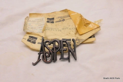 NOS MoPar 1976 77 78 79 80 Dodge ASPEN Fender side chrome Name Plate  pn 4022360 - Image 1 of 1