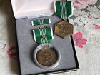lot of 2 vintage Military Merit Medal, one with a case