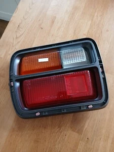 Datsun Cherry F10,LH Rear combination lens,sedan Model new Unboxed genuine. - Picture 1 of 2