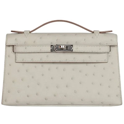 Bolso de mano Hermes Kelly Pochette gris perla avestruz con herrajes de paladio Foto 1 de 4