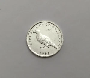 1994 Somaliland Moneta da 1 scellino, KM #1 non in circolazione/piccione uccellino - Foto 1 di 2
