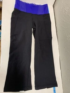 LULULEMON BLACK CAPRIS WITH ROYAL BLUE WAISTBAND SLITS ON BACK OF LEG SIZE 4 - Picture 1 of 7