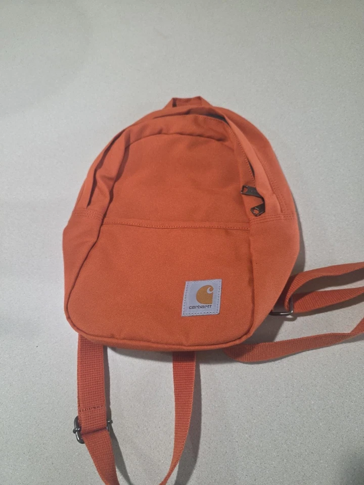 Dark orange carhartt mini backpack, adjustable straps, never used - Image 1 of 4