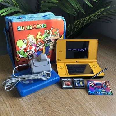 Nintendo DSi XL Yellow Console Bundle NEAR MINT CONDITION - image 1 of 4