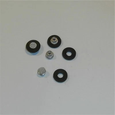 Corgi Toys  341 Mini Marcos  Set of 4 Golden Jacks Wheel Hubs & Tyres - Image 1 of 4