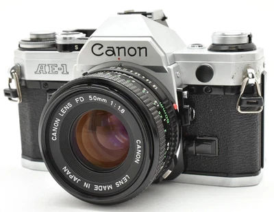 ▶️ Cámara fotográfica Exc Canon AE-1 plateada 35 mm NFD NUEVA FD 50 mm f/1,8 Japón 2585942 Foto 1 de 4