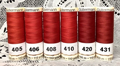 6 NEW different red colors GUTERMANN 100% polyester thread 110 yard spools - Image 1 of 4