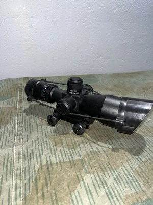 Mira telescópica zoom 4x con retícula iluminada de punto rojo/verde con puntero láser rojo Foto 1 de 4