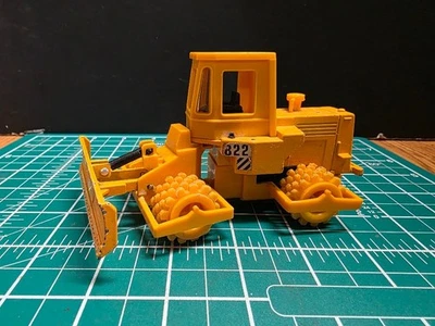 Bulldozer Bauer B22 escala 1:64 VER FOTOS (LOTE 689) Foto 1 de 4