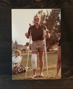 Vintage Color Photo Man Shorts Broken Leg In Cast Crutches Smoking With A Beer - Picture 1 of 4