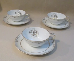 3 Kaffeetassen & Untertassen Sets Noritake Esteem 5404 blau & braun Schnörkel Goldrand - Bild 1 von 10
