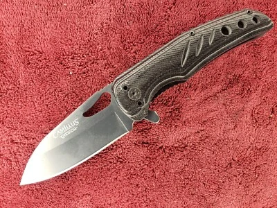 Cuchillo de bolsillo Camillus Carbonitrude Titanium AUS-8 negro bloqueo de revestimiento Foto 1 de 4