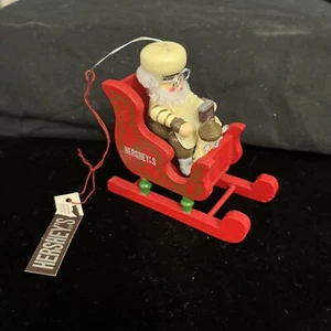 HERSHEYS CHOCOLATE VINTAGE ORNAMENT BAKER ELF IN SLEIGH CARRYING CHOCOLATE NEW - Picture 1 of 6