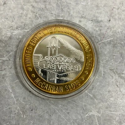 Vintage McCarran Slots Airport 999 Silver Limited Ten Dollar Gaming Token - Image 1 of 3