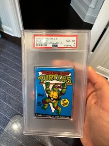 Pop 2! 1990 Topps TMNT Teenage Mutant Ninja Turtles Wax Pack Donatello PSA 8 - Picture 1 of 3