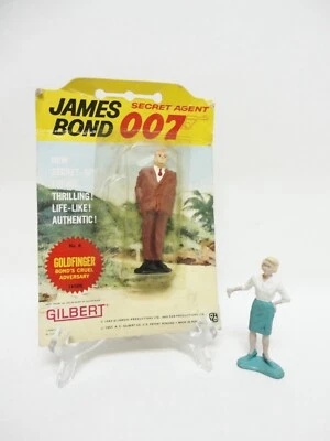 20 世纪 60 年代吉尔伯特玩具 - 詹姆斯·邦德 4 英寸橡胶人物 - GOLDFINGER & Ms. Moneypenny — 第 1/4 张图片
