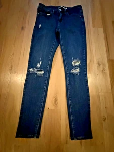 Pantalones de mezclilla ajustados Levi’s 711 para mujer desgastados tiro medio elásticos 27 - Imagen 1 de 4