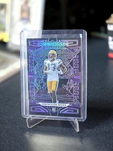 2023 Panini Obsidian #138 Dontayvion Wicks Electric Etch Purple #/75 - Picture 1 of 2