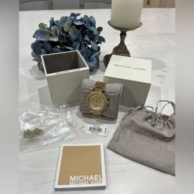 Michael Kors jeweled gold colored watch with box, bag, pillow needs batteries - Image 1 of 4
