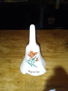 VTG Souvenir Bell from Wyoming has State flower on it - Picture 1 of 3