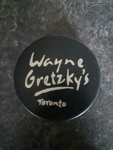 Wayne Gretzky's Toronto Canada Restaurant Hockey Puck - Picture 1 of 2