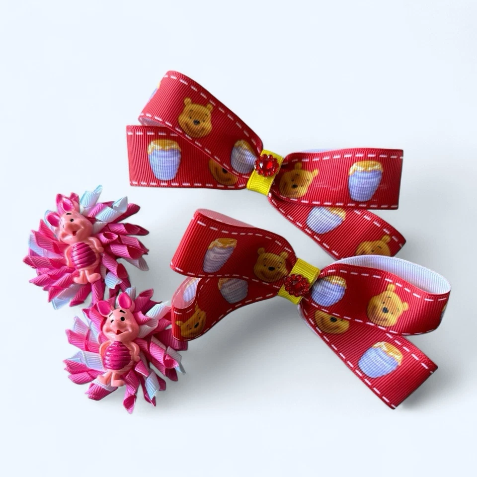 Lote de 2 pares de clips de cocodrilo con moño para niños pequeños de Winnie The Poo - Foto 1 de 4