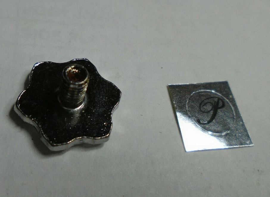 PFLUEGER reel (new) parts,  handle nut (screw) or nut label,  1275799, 1275800 - Image 1 of 1