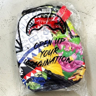 *NEW* SPRAYGROUND MEAN MONEY COLLAGE BACKPACK WHITE (B8308) 👍 - Image 1 of 4