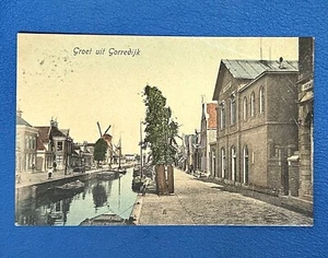 Gorredijk PAÍSES BAJOS • Molinos de viento calle Canal Barcos Gente • Publicado 1907 - Imagen 1 de 2