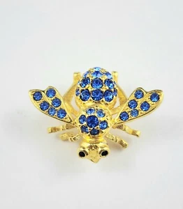 Prendedor vintage firmado por Joan Rivers cristal azul estrás insecto abeja tono dorado - Imagen 1 de 7