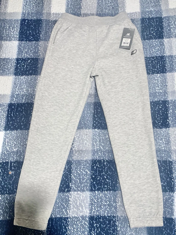 Pantalones deportivos New Balance ATH gris jaspeado Foto 1 de 4